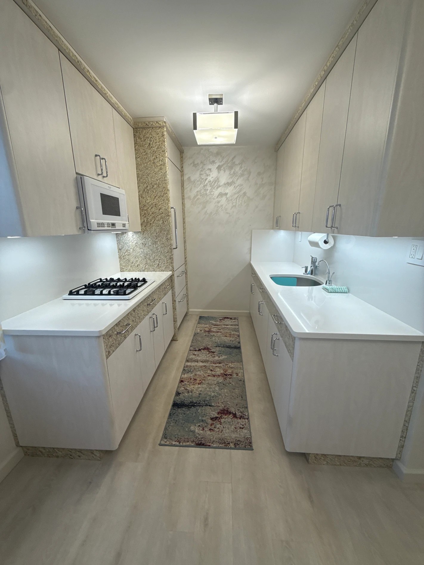 Custom cabinetry paired with a modern backsplash and upgraded hardware for a clean, functional kitchen update.